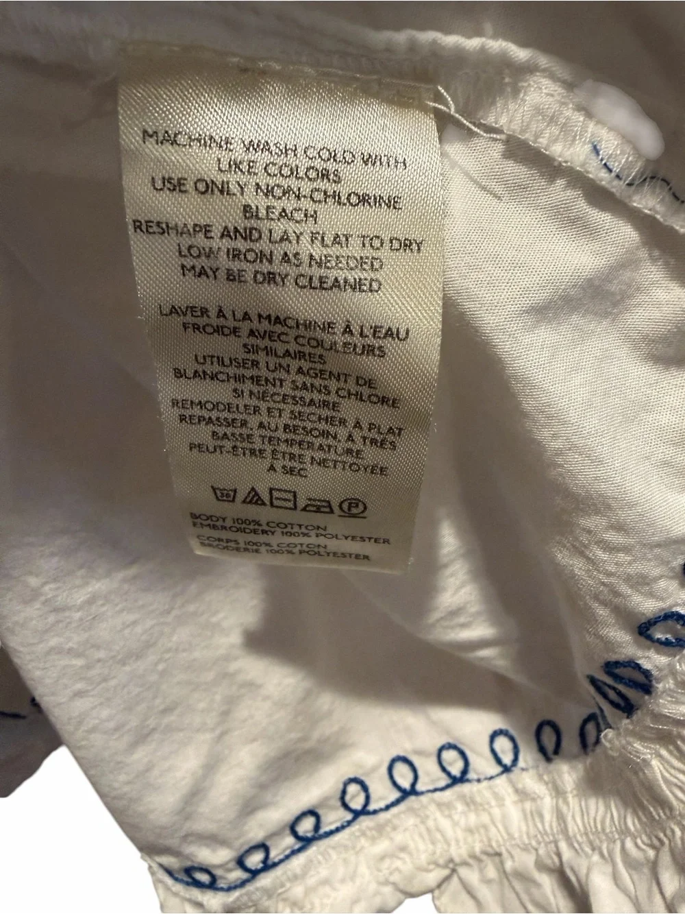 Anthropologie White Babydoll Top with Blue Embroidered Floral Detail Medium
